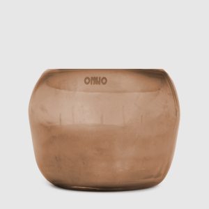Cape Copper M candle with Zanzibar scent in a glass candle holder Onno