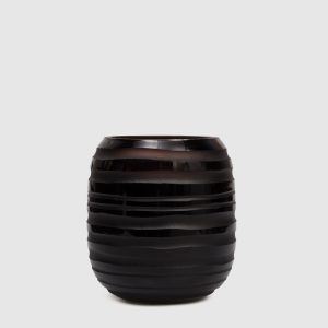 Sphere Amber S candle with Zanzibar scent in a glass candle holder Onno