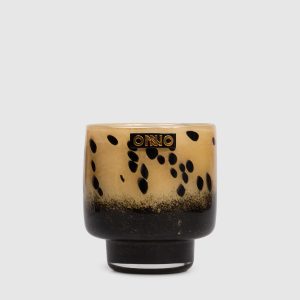 Art Brigitte S candle with Zanzibar scent in a glass candle holder Onno