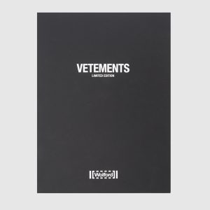 Black tights in a logo pattern collaboration with Wolford Vetements